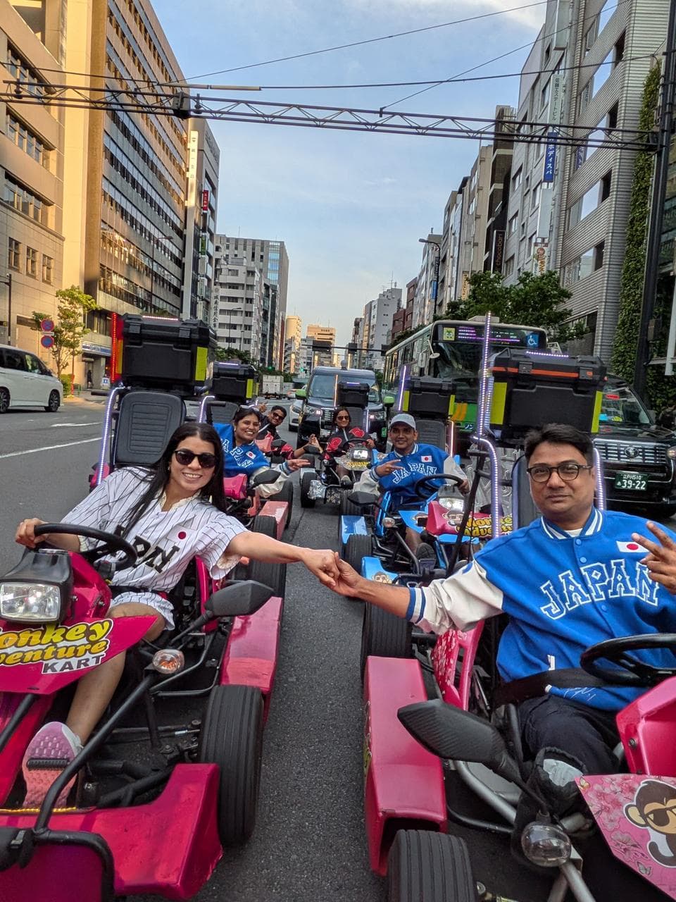 Travellers on a Mario Kart ride through Tokyo